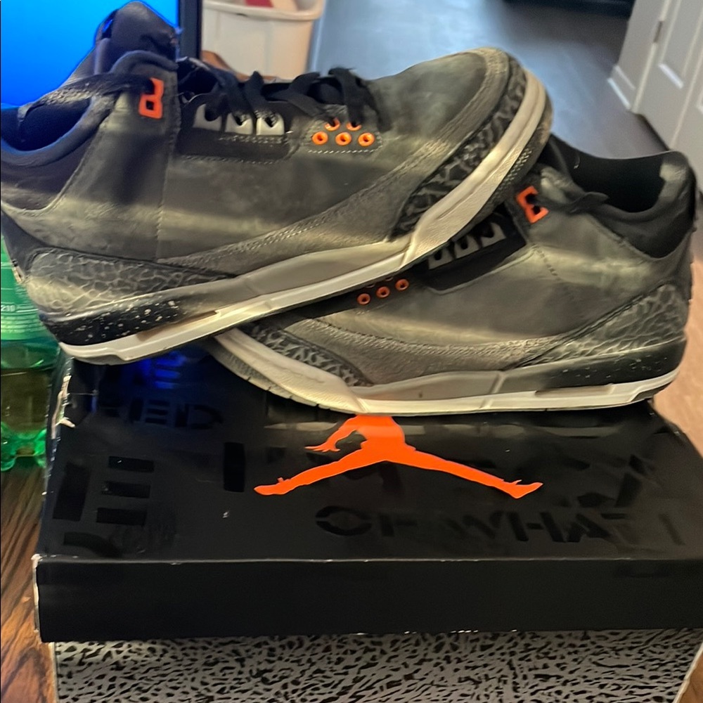 Jordan Black and Orange Sneakers with Iconic Jumpman Logo